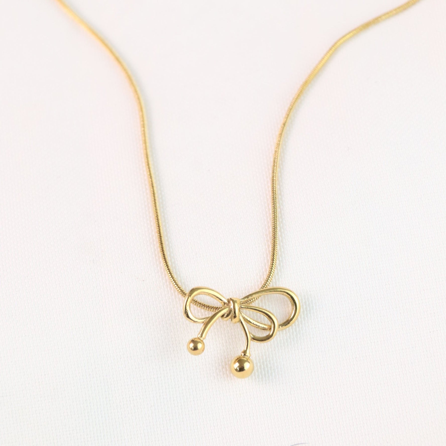 Nina - Gold Bow Necklace